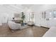 Bright living room featuring stylish seating, herringbone floors, and plenty of natural light at 9031 N 83Rd Way, Scottsdale, AZ 85258