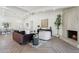 Bright living room features herringbone floors and a cozy fireplace at 9031 N 83Rd Way, Scottsdale, AZ 85258