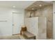 Modern bathroom with walk-in shower and built-in bench at 9448 N 80Th Pl, Scottsdale, AZ 85258