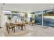 Bright dining area with sliding glass doors leading to a backyard pool at 9448 N 80Th Pl, Scottsdale, AZ 85258