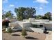 Mid-century modern home with a clean, white exterior at 9448 N 80Th Pl, Scottsdale, AZ 85258