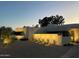 Modern home exterior at dusk with landscape lighting at 9448 N 80Th Pl, Scottsdale, AZ 85258