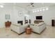 Open concept living room with fireplace and TV at 9448 N 80Th Pl, Scottsdale, AZ 85258