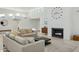 Light-filled living room with a fireplace and seating area at 9448 N 80Th Pl, Scottsdale, AZ 85258