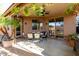 Covered patio with seating area, perfect for outdoor dining and relaxation at 10022 N Erin Ct, Waddell, AZ 85355