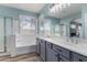 Double vanity bathroom with soaking tub and separate shower at 10022 N Erin Ct, Waddell, AZ 85355