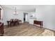 Bright dining room with hardwood floors and elegant chandelier at 10022 N Erin Ct, Waddell, AZ 85355