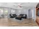 Living room with leather furniture and built-in shelving at 10022 N Erin Ct, Waddell, AZ 85355