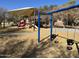 Playground with swings and play structures at 10022 N Erin Ct, Waddell, AZ 85355