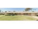 Brick ranch home with a large yard and mature trees at 10025 W Shasta W Dr, Sun City, AZ 85351