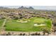 Aerial view of a golf course with desert landscape in the background at 10222 E Southwind E Ln # 1026, Scottsdale, AZ 85262