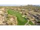 Aerial view of a golf course surrounded by desert landscape and homes at 10222 E Southwind E Ln # 1026, Scottsdale, AZ 85262