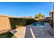 Relaxing backyard oasis featuring a refreshing pool, lush landscaping, and a private feel at 10434 E Texas Ave, Mesa, AZ 85212