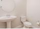 Simple bathroom with pedestal sink and toilet at 10434 E Texas Ave, Mesa, AZ 85212