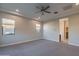 Primary bedroom with carpet and ceiling fan at 10434 E Texas Ave, Mesa, AZ 85212