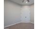 Spacious bedroom with carpeted floors and double doors at 10434 E Texas Ave, Mesa, AZ 85212