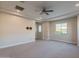 Primary bedroom with carpeted floors and window at 10434 E Texas Ave, Mesa, AZ 85212