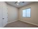 Bright bedroom with carpeted floors and window at 10434 E Texas Ave, Mesa, AZ 85212