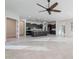 Open living room with tile floors and ceiling fan at 10434 E Texas Ave, Mesa, AZ 85212