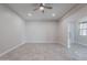 Living room with tile floors, glass door and ceiling fan at 10434 E Texas Ave, Mesa, AZ 85212