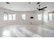 Bright living room features tile floors and multiple windows at 10434 E Texas Ave, Mesa, AZ 85212