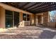 Covered patio with pergola, brick pavers, and iron gate at 10434 E Texas Ave, Mesa, AZ 85212