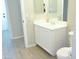 Clean bathroom, vanity with white cabinets, and toilet at 10549 E Flossmoor Ave, Mesa, AZ 85208