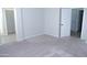 Spacious bedroom with carpet flooring and access to bathroom at 10549 E Flossmoor Ave, Mesa, AZ 85208