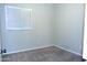 Bright bedroom with window and neutral carpet at 10549 E Flossmoor Ave, Mesa, AZ 85208