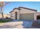 Single-story home with a two-car garage and well-manicured lawn at 10549 E Flossmoor Ave, Mesa, AZ 85208