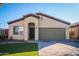 Single-story home with a two-car garage and well-manicured lawn at 10549 E Flossmoor Ave, Mesa, AZ 85208