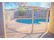 Inviting swimming pool with safety fence at 10549 E Flossmoor Ave, Mesa, AZ 85208