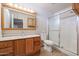 Bathroom with wood cabinets and shower/tub combo at 10615 N 102Nd Dr, Sun City, AZ 85351