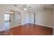 Open dining area with wood flooring and access to living room at 10615 N 102Nd Dr, Sun City, AZ 85351