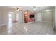 Open concept living room with tile floors and kitchen access at 10615 N 102Nd Dr, Sun City, AZ 85351