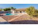 Charming kidney shaped pool with walkway at 10811 E Contessa St, Mesa, AZ 85207