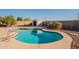 Relaxing kidney-shaped pool with storage shed at 10811 E Contessa St, Mesa, AZ 85207