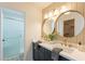 Bathroom boasts double vanity, round mirrors, and gold fixtures at 10811 E Contessa St, Mesa, AZ 85207