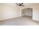 Large bedroom with carpet, ceiling fan, and walk-in closet at 10811 E Contessa St, Mesa, AZ 85207