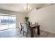 Dining area with sliding door leading to a view of the pool at 10811 E Contessa St, Mesa, AZ 85207