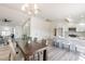 Open concept dining area with views into the kitchen and living room at 10811 E Contessa St, Mesa, AZ 85207