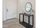 Modern entryway with console table and mirror at 10811 E Contessa St, Mesa, AZ 85207