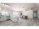 Modern kitchen with white shaker cabinets, quartz countertops, and stainless steel appliances at 10811 E Contessa St, Mesa, AZ 85207