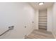 Laundry room with built-in shelving and vinyl flooring at 10811 E Contessa St, Mesa, AZ 85207