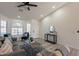 Bright living room with a bay window and a modern console table at 10811 E Contessa St, Mesa, AZ 85207