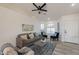 Living room with vaulted ceiling, comfy seating, and plenty of light at 10811 E Contessa St, Mesa, AZ 85207