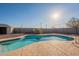 Sparkling kidney-shaped pool with a storage shed at 10811 E Contessa St, Mesa, AZ 85207