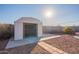 White storage shed with double doors at 10811 E Contessa St, Mesa, AZ 85207