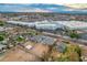 Aerial view showcasing a new build home's location near commercial buildings at 10869 N 81St Ave, Peoria, AZ 85345