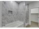 Bathroom with marble shower and soaking tub at 10869 N 81St Ave, Peoria, AZ 85345